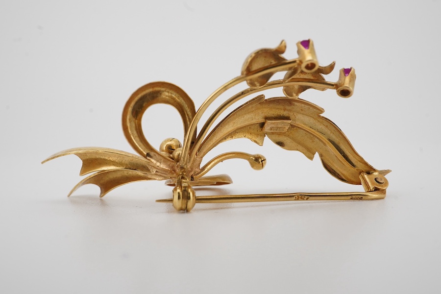 A modern 18k and two stone ruby set foliate spray brooch, 50mm, gross weight 6.7 grams. Condition - fair to good